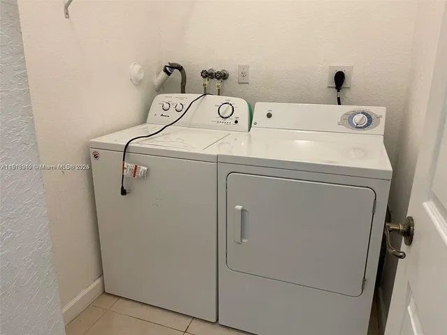 a bathroom with a sink and a large mirror