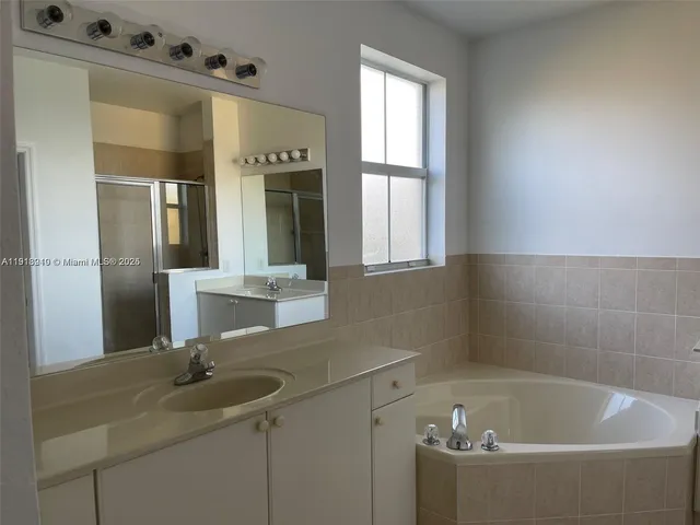 a bathroom with a bathtub and toilet