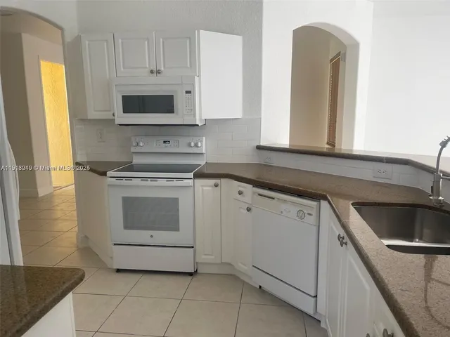 a bathroom with a sink toilet and bathtub