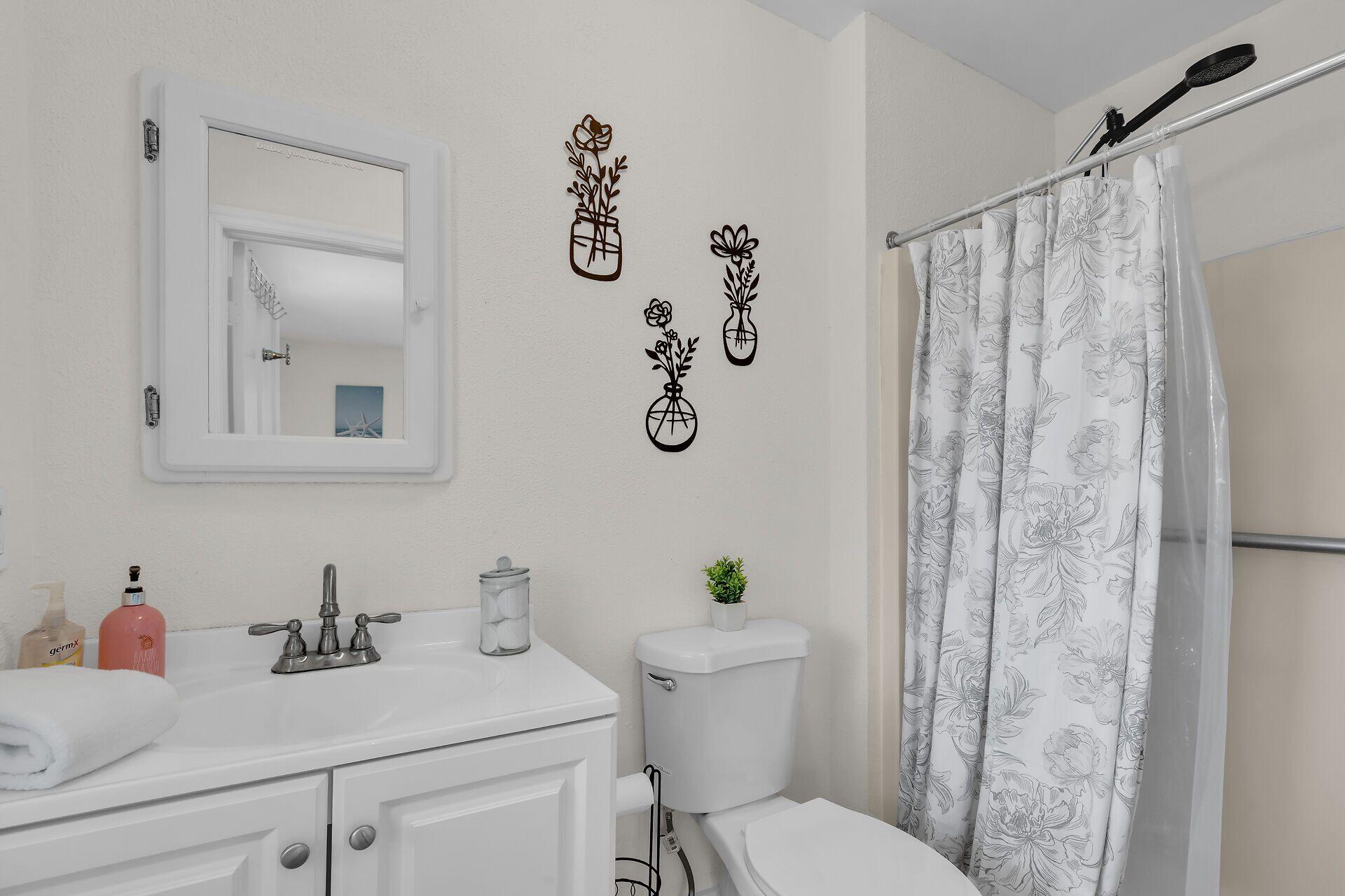 878 La Paloma Road Key Largo, FL 33037 - Photo 18 of 38 a bathroom with a sink and toilet