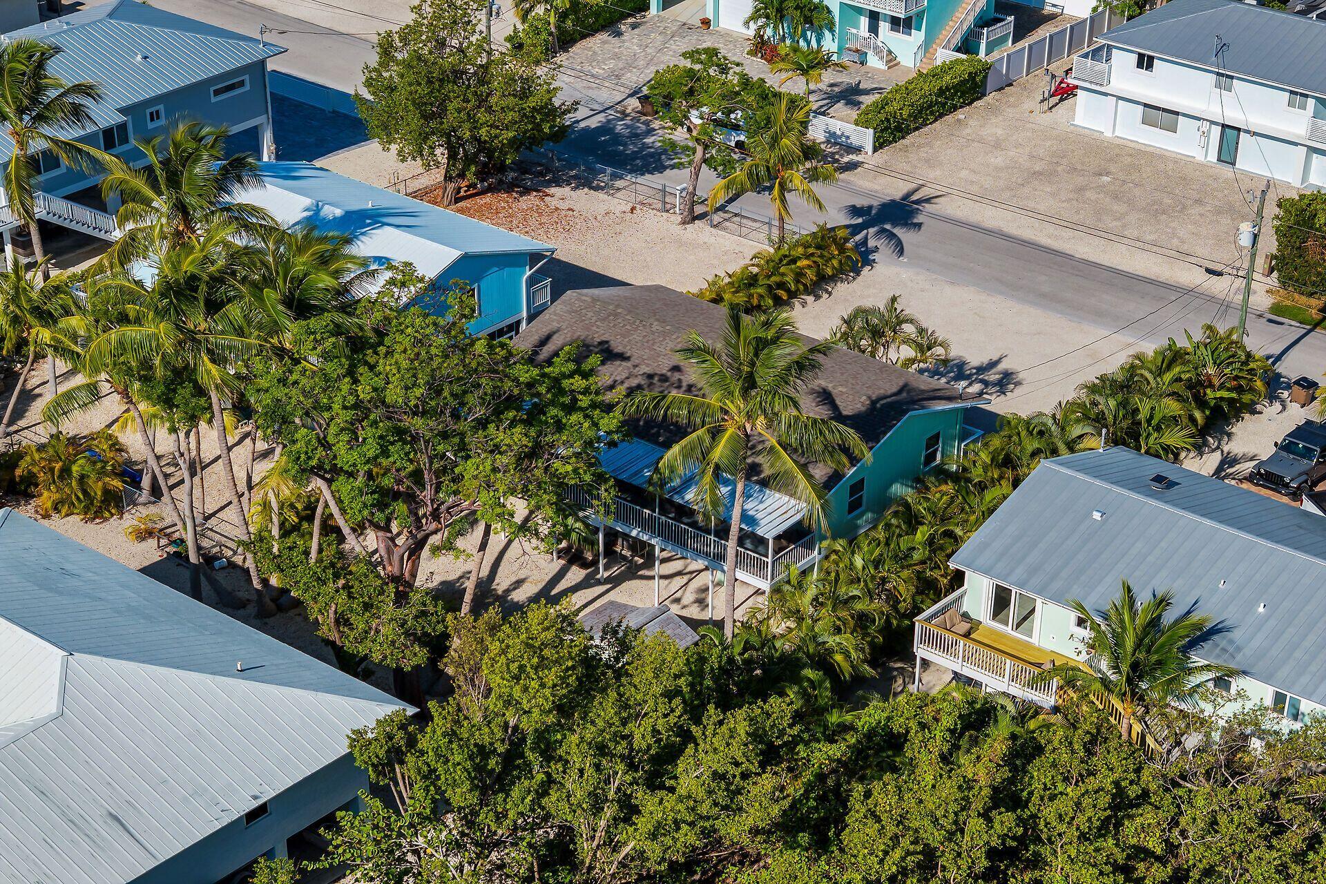 878 La Paloma Road Key Largo, FL 33037 - Photo 37 of 38 an aerial view of a house with a yard