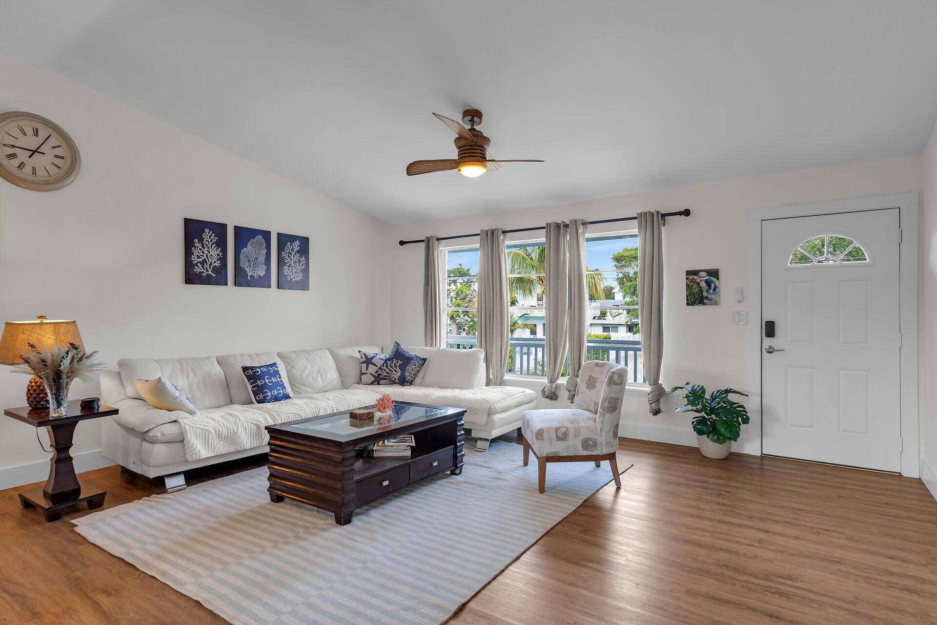 878 La Paloma Road Key Largo, FL 33037 - Photo 7 of 38 a living room with furniture and wooden floor
