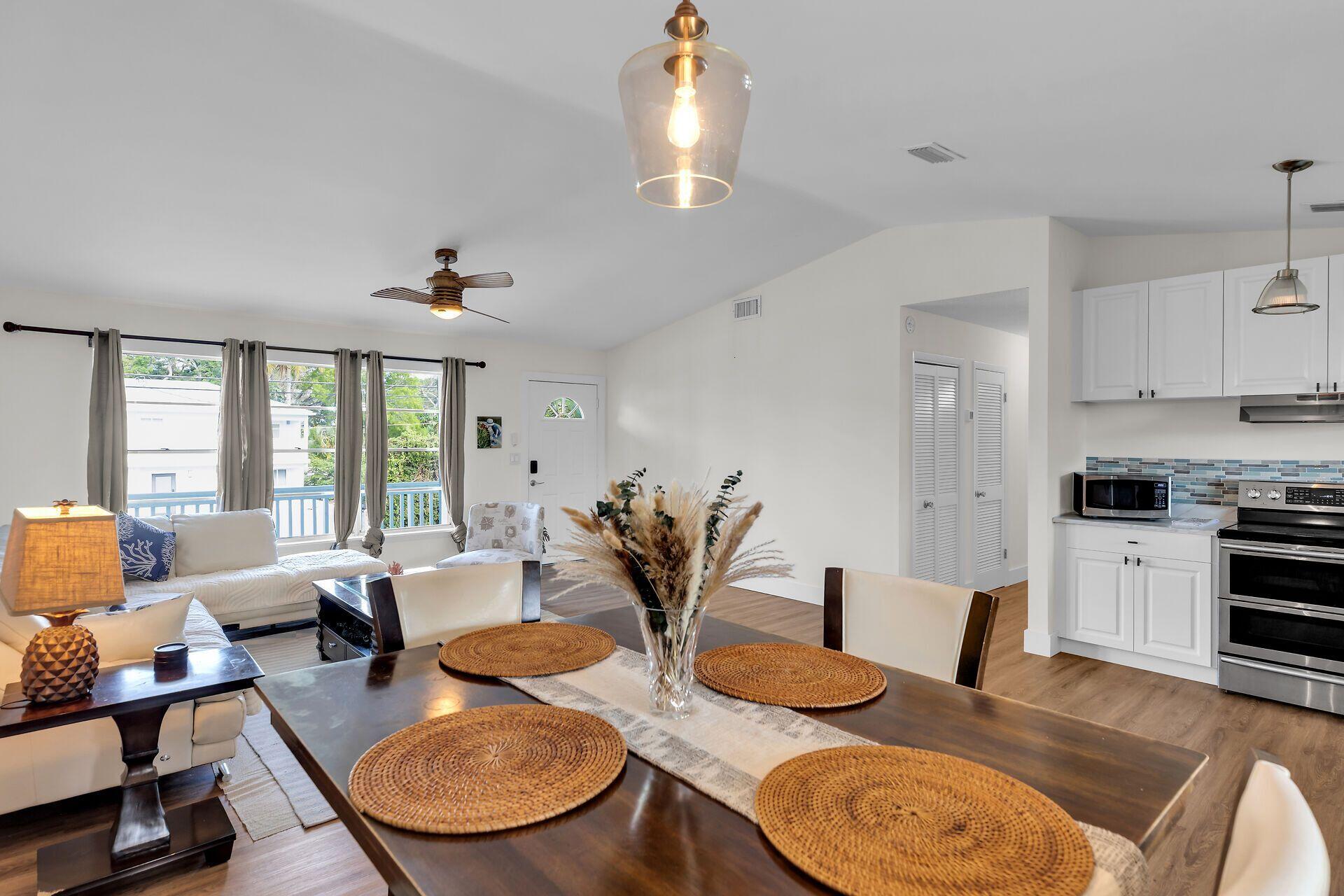 878 La Paloma Road Key Largo, FL 33037 - Photo 9 of 38 a living room with furniture and wooden floor