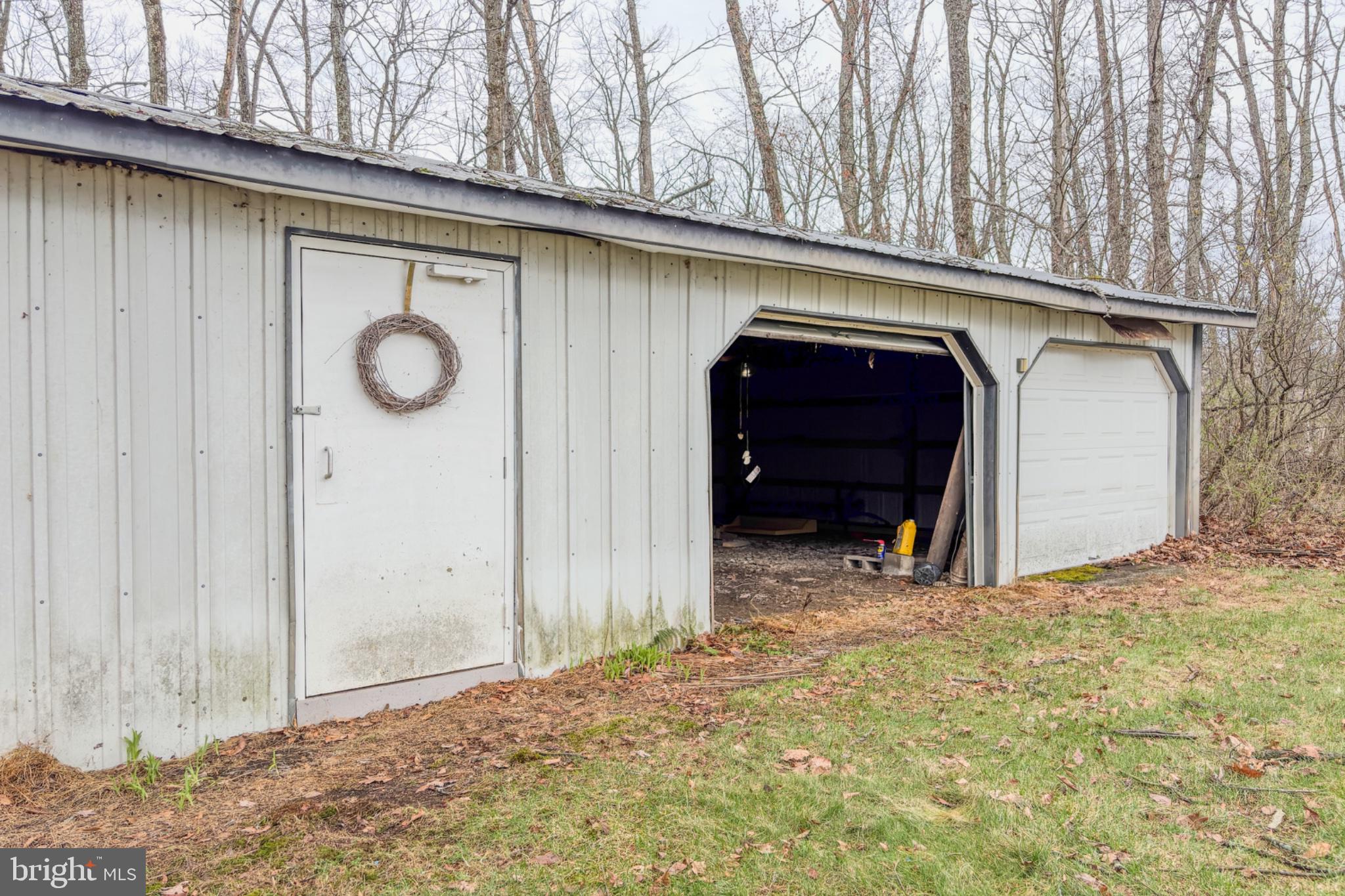 467 Swanger Road New Columbia, PA 17856 - Photo 45 of 45 Rustic shed nestled in serene woods.