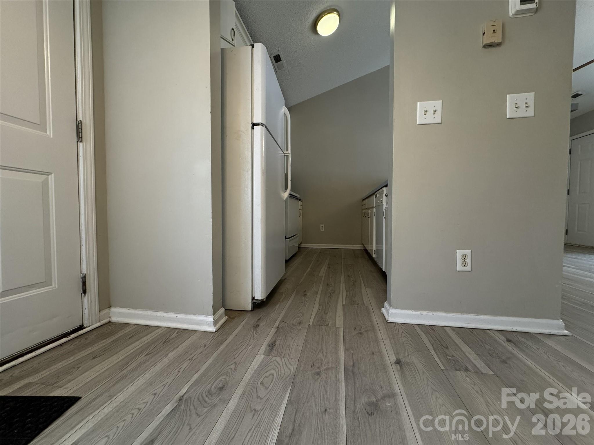 114 South Branch Street Monroe, NC 28112 - Photo 14 of 44 a view of a hallway with wooden floor and staircase