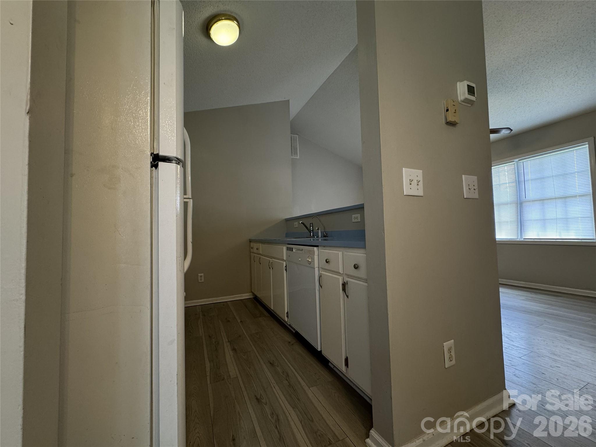 114 South Branch Street Monroe, NC 28112 - Photo 15 of 44 a kitchen with refrigerator and window