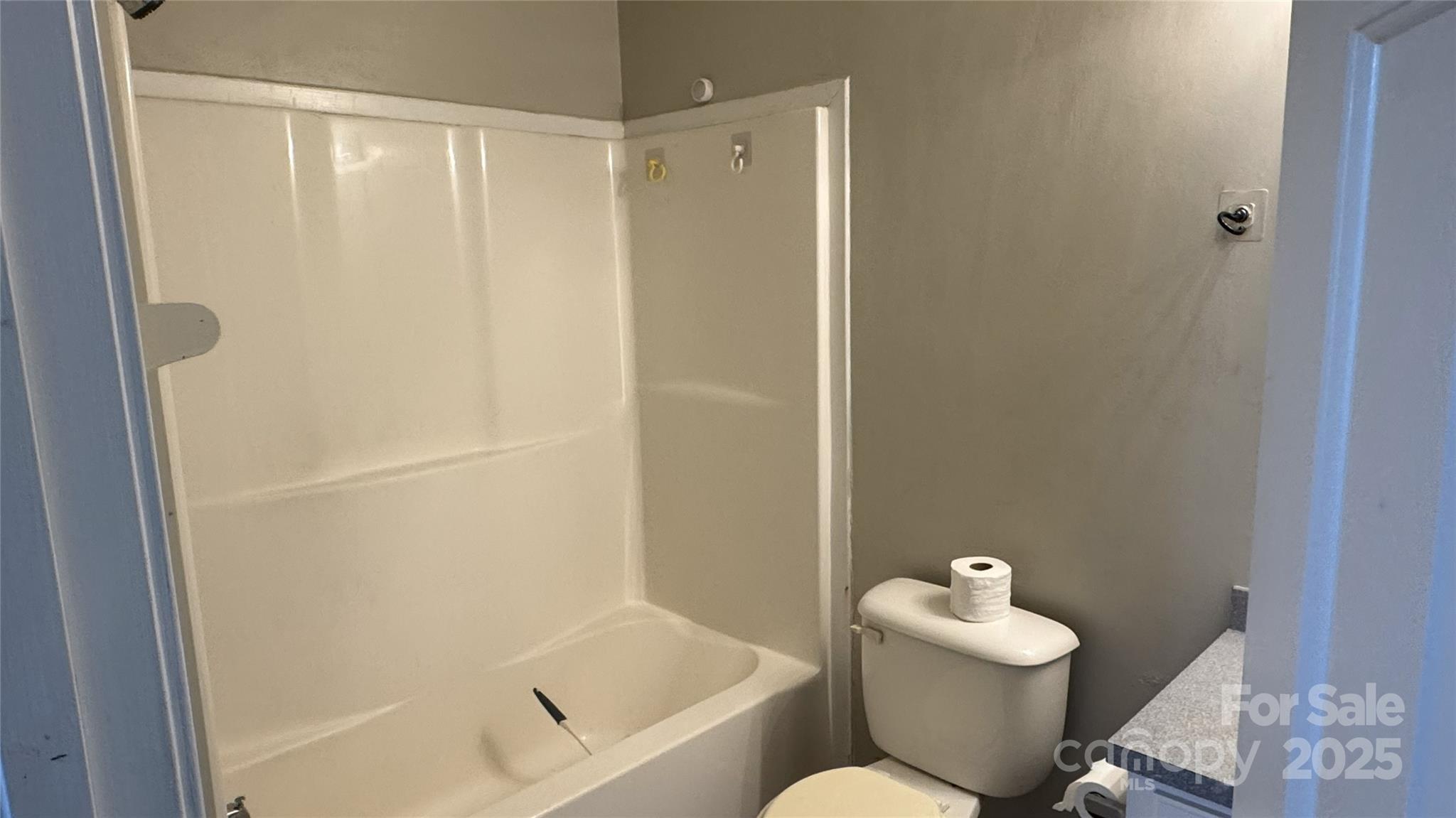 114 South Branch Street Monroe, NC 28112 - Photo 19 of 32 a bathroom with a toilet and a shower