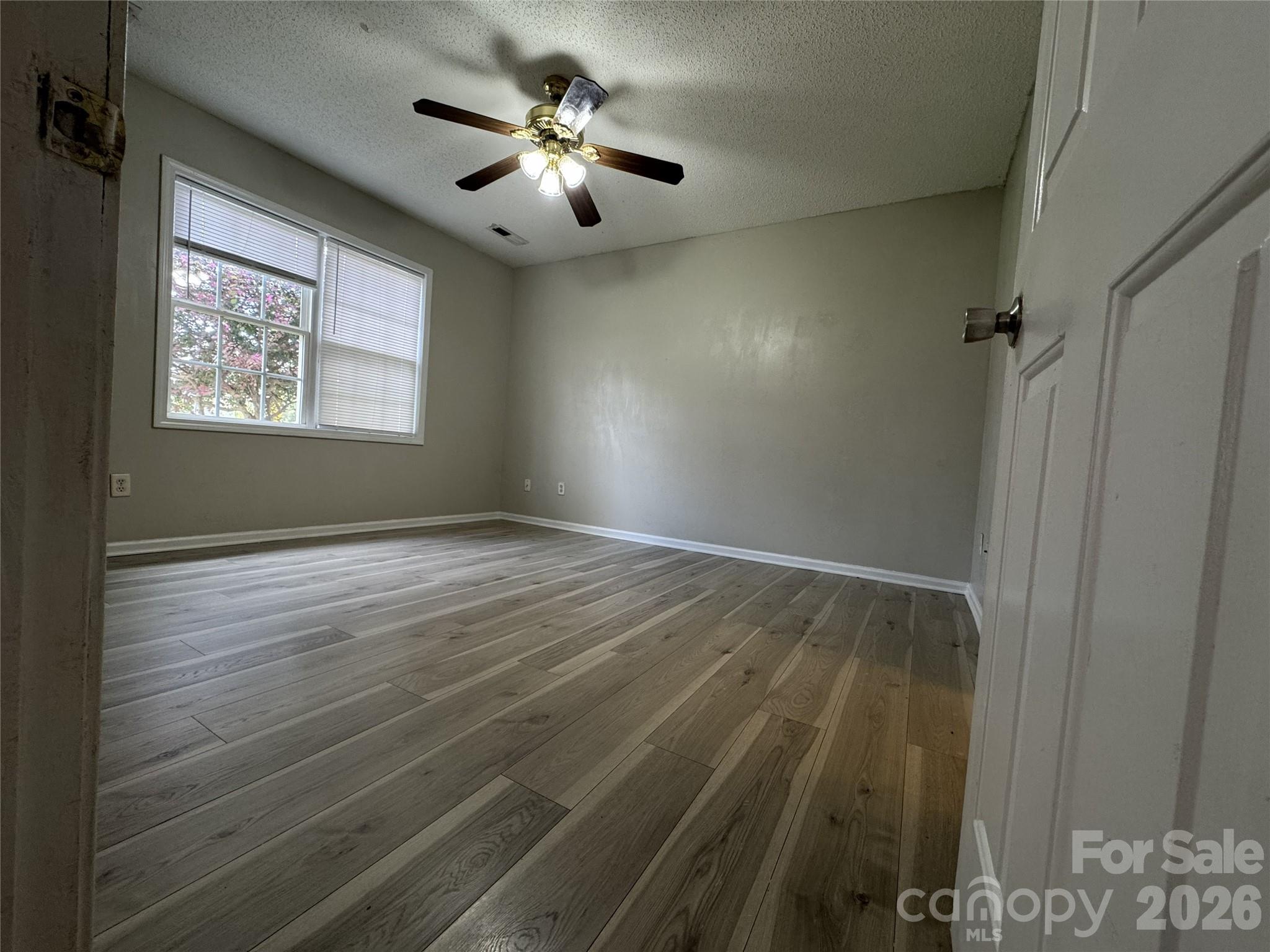 114 South Branch Street Monroe, NC 28112 - Photo 20 of 44 wooden floor in an empty room with a window