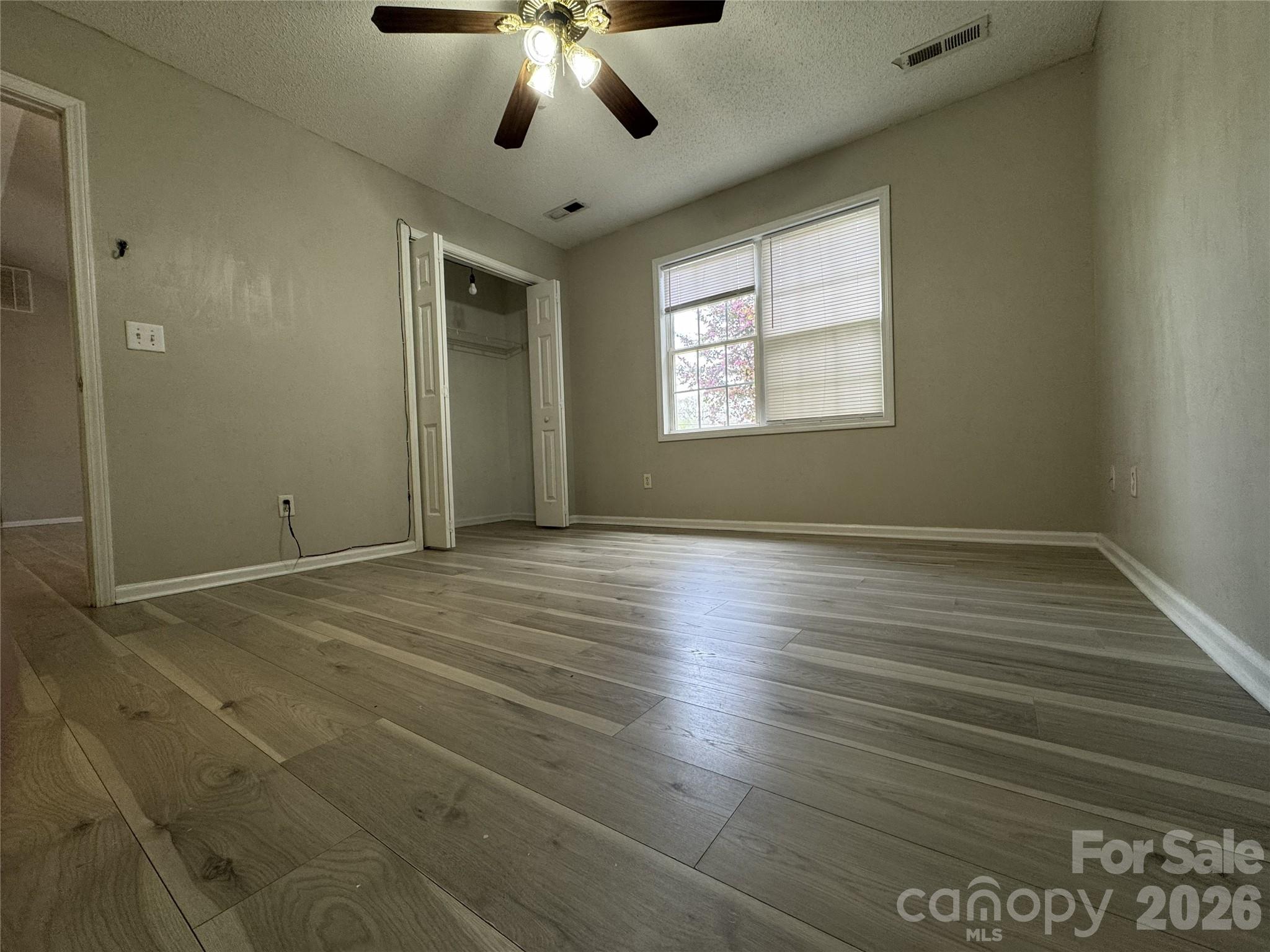 114 South Branch Street Monroe, NC 28112 - Photo 21 of 44 a view of an empty room with wooden floor and a window