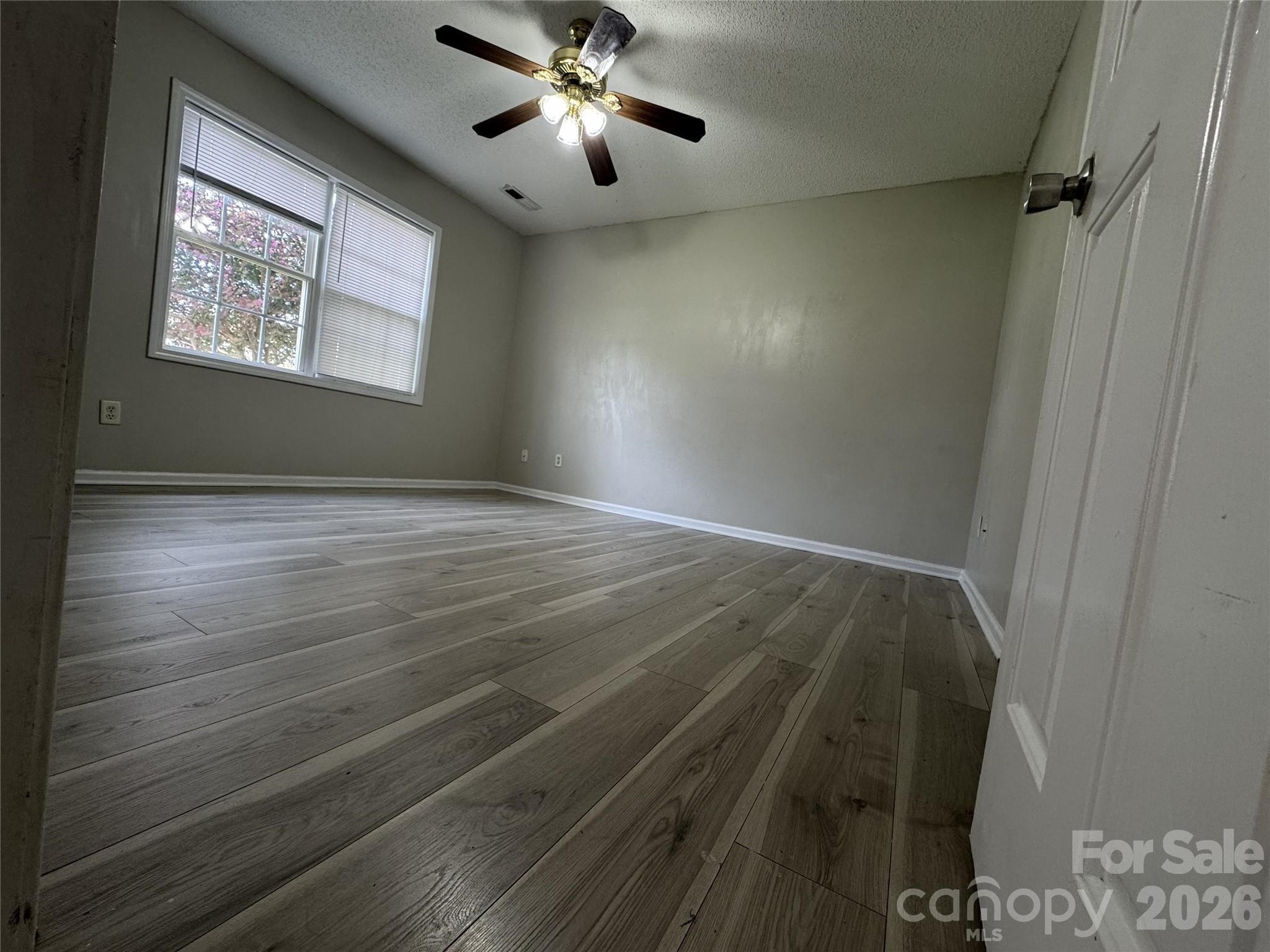 114 South Branch Street Monroe, NC 28112 - Photo 22 of 44 wooden floor in an empty room with a window