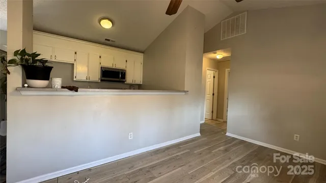 a view of a storage and utility room with two washing machine