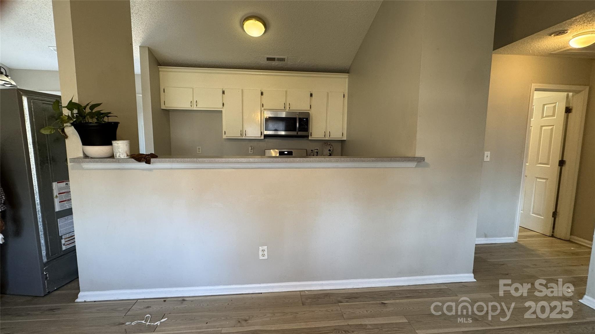 114 South Branch Street Monroe, NC 28112 - Photo 25 of 32 a view of a kitchen with a sink and a refrigerator