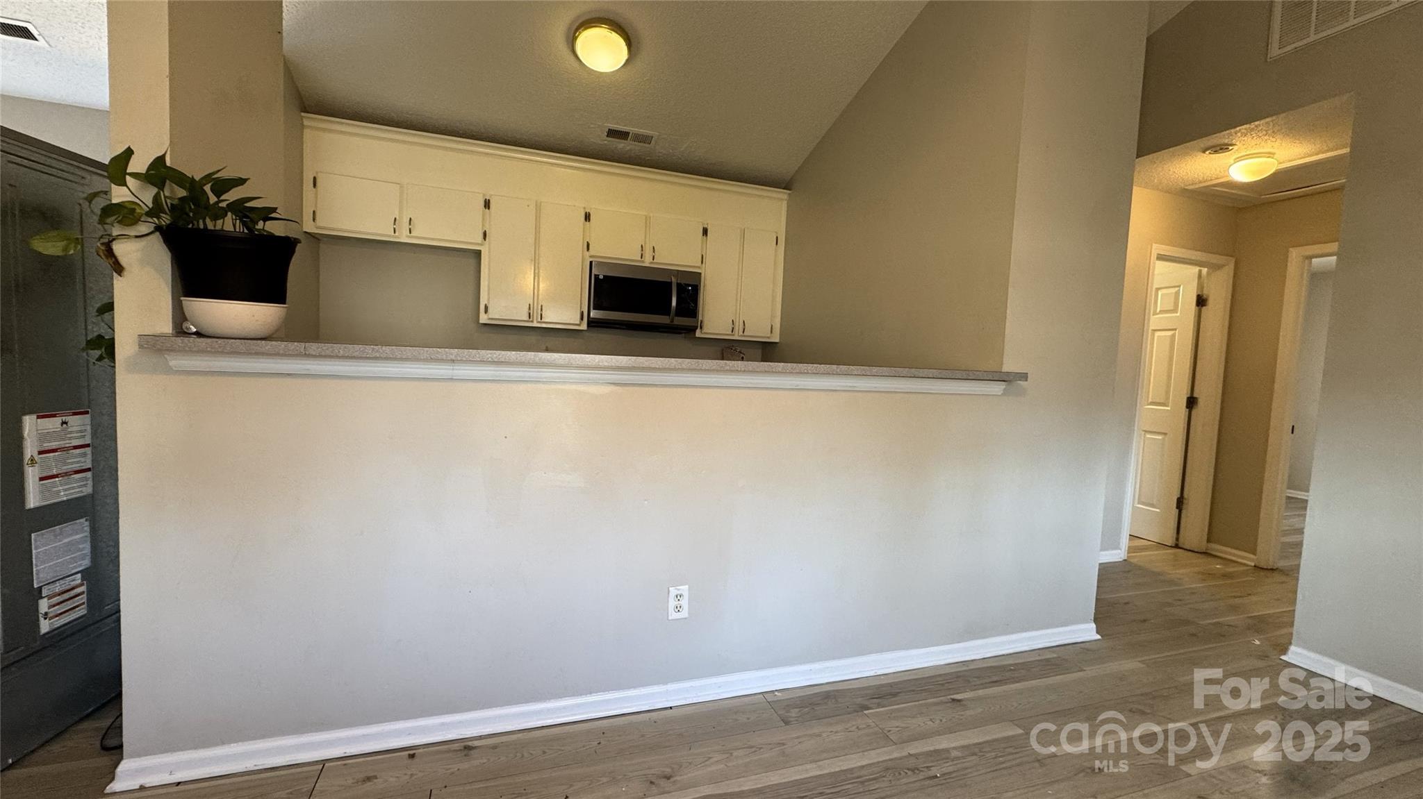 114 South Branch Street Monroe, NC 28112 - Photo 26 of 32 a view of a storage & utility room with empty racks
