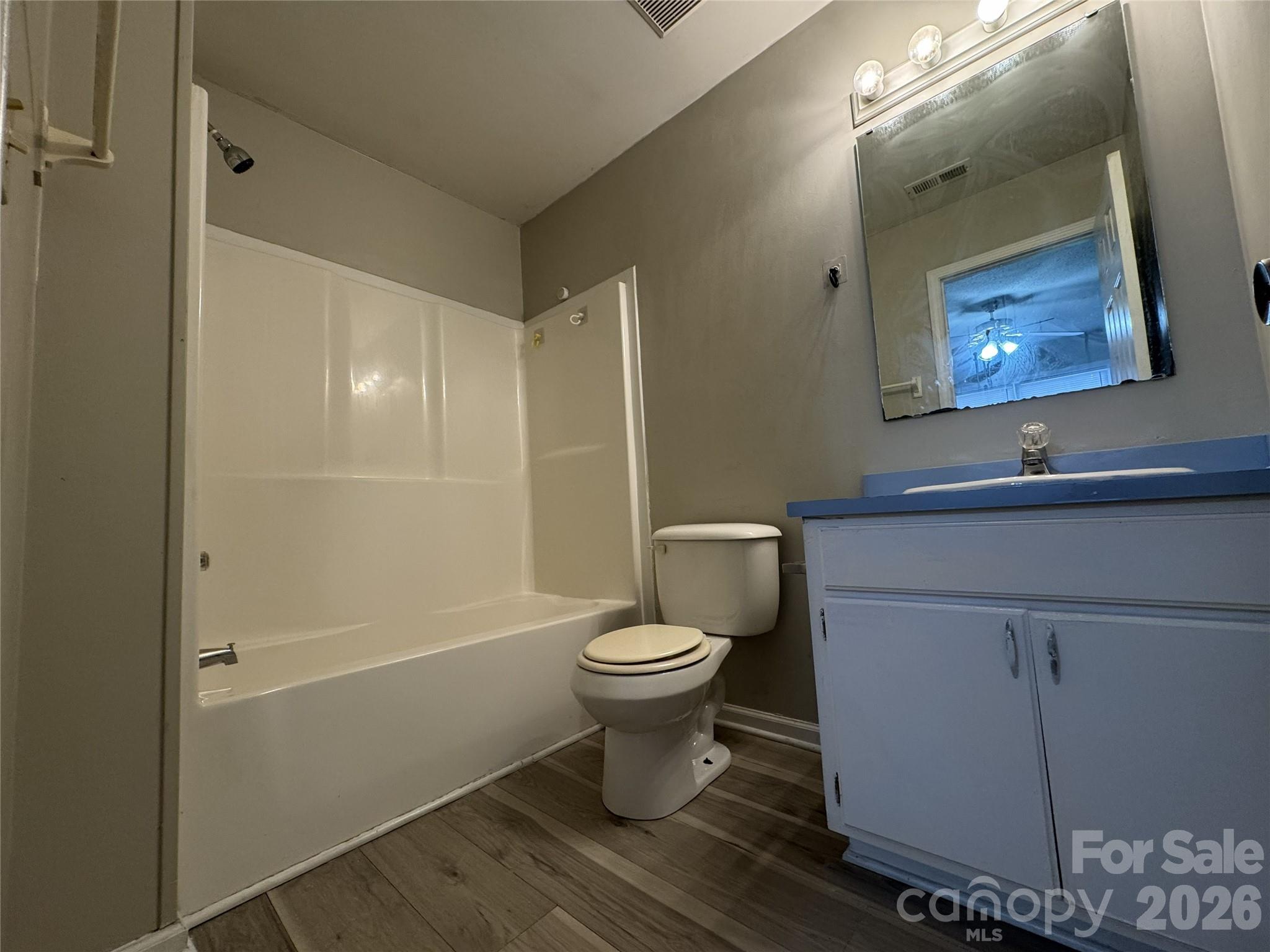 114 South Branch Street Monroe, NC 28112 - Photo 27 of 44 a bathroom with a toilet sink and mirror