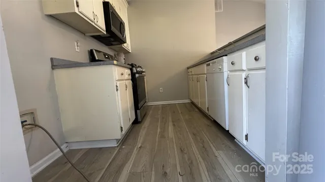 a view of a storage & utility room with stairs