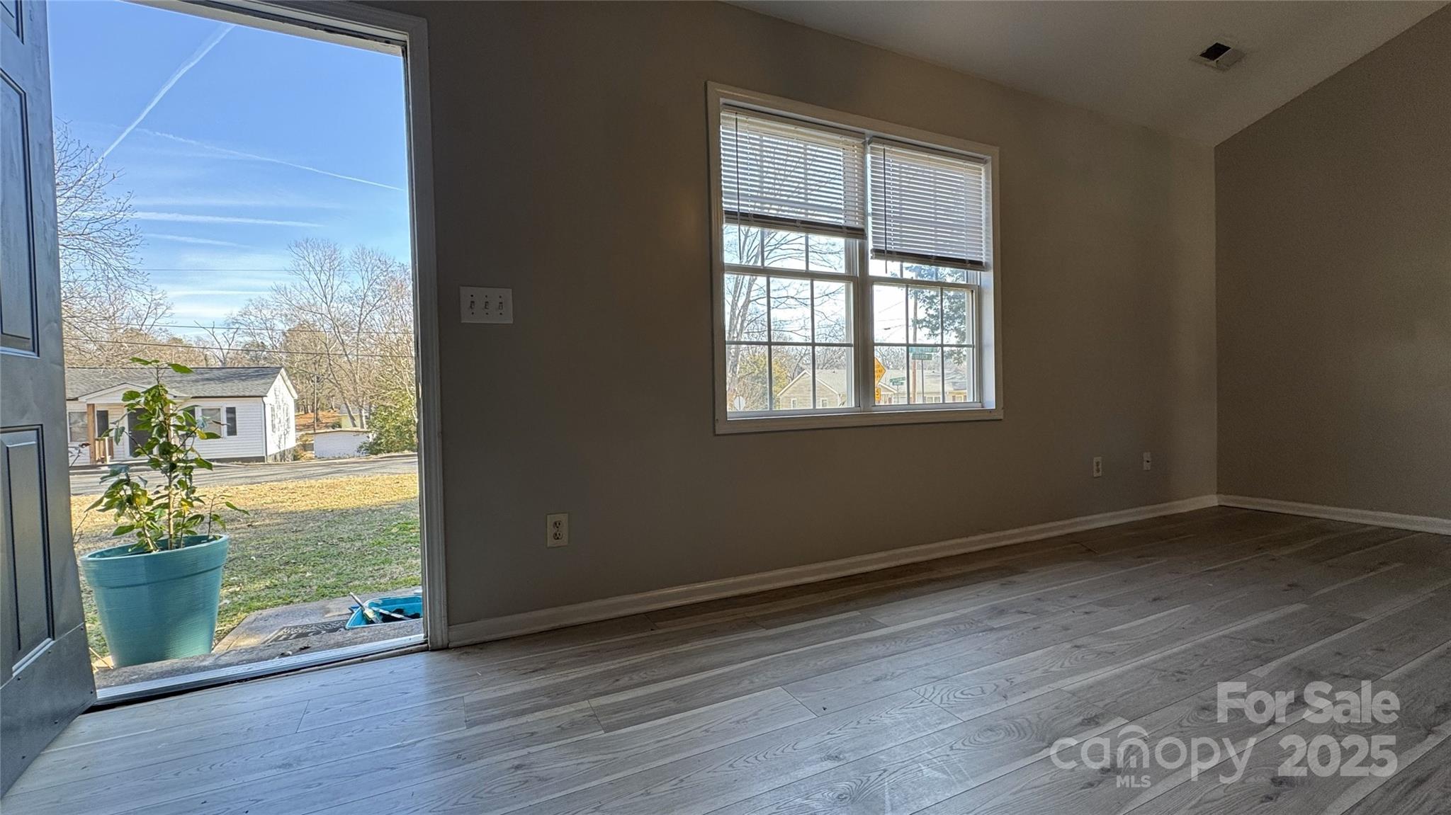 114 South Branch Street Monroe, NC 28112 - Photo 30 of 32 an empty room with wooden floor and a window