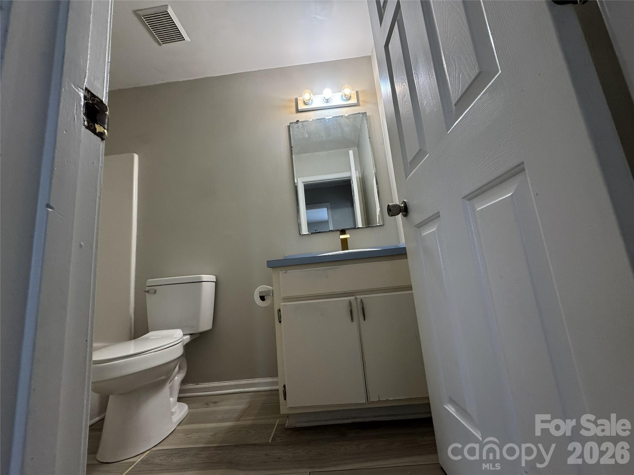 114 South Branch Street Monroe, NC 28112 - Photo 37 of 44 a bathroom with a toilet sink and mirror