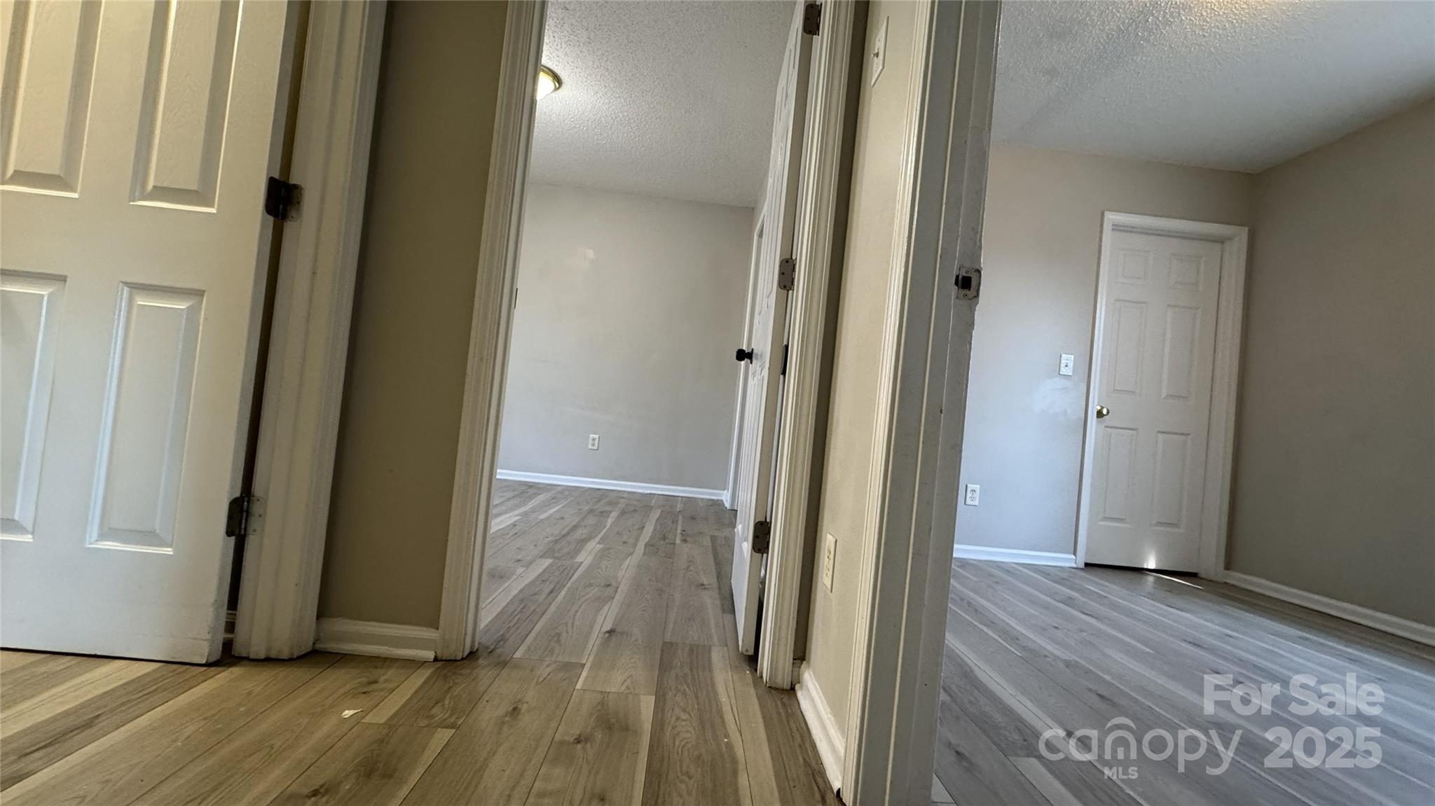 114 South Branch Street Monroe, NC 28112 - Photo 4 of 32 a view of a hallway with wooden floor and staircase