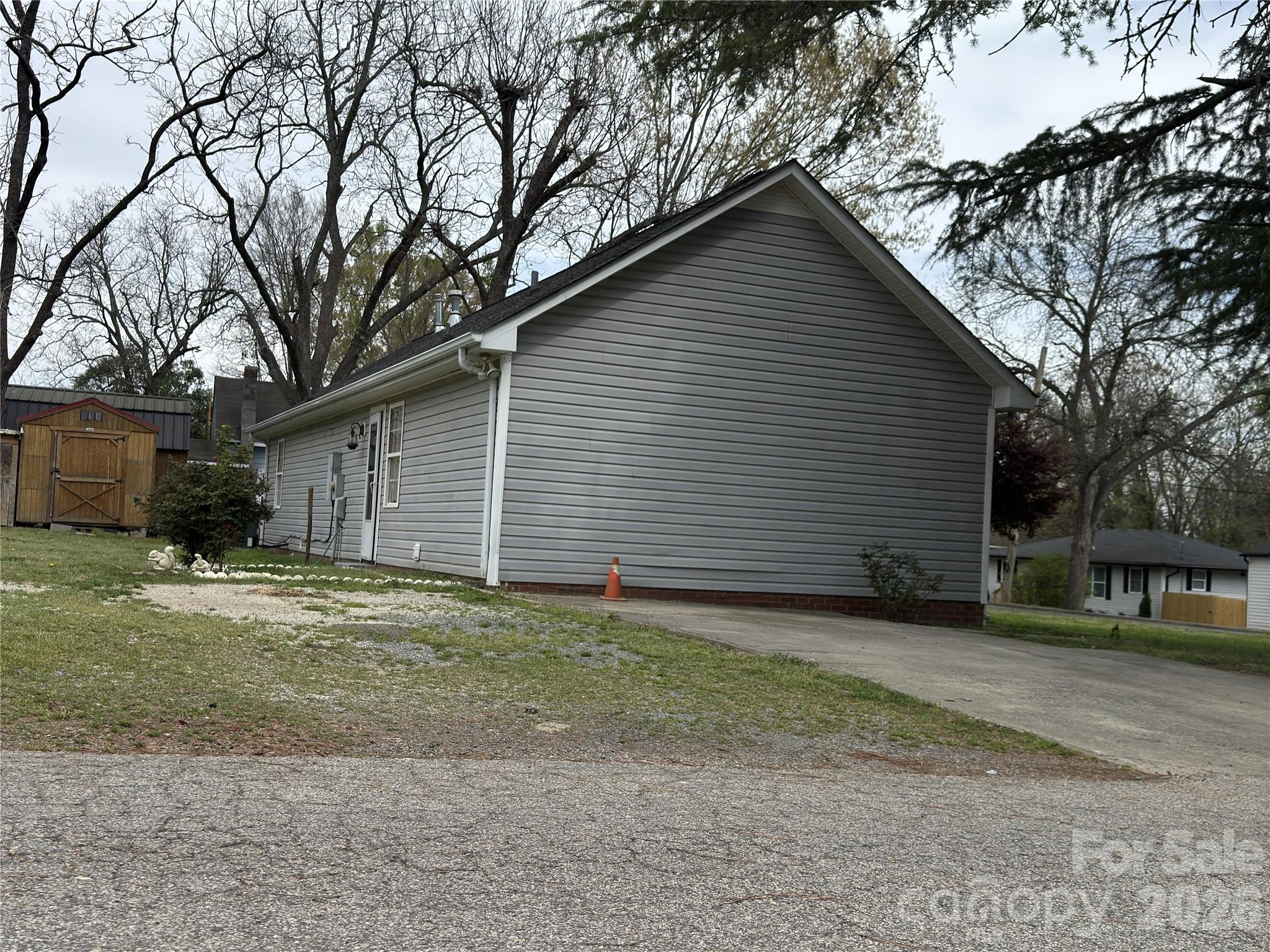 114 South Branch Street Monroe, NC 28112 - Photo 43 of 44 a view of a house with a yard and large tree