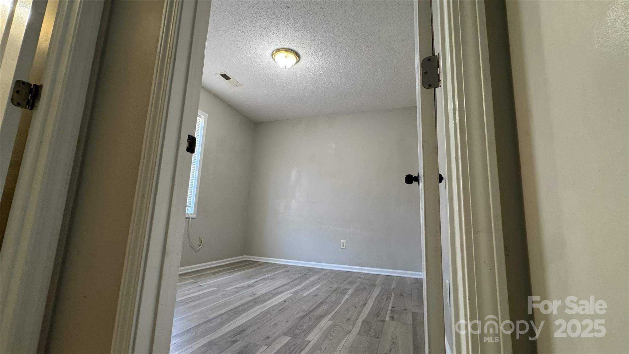 114 South Branch Street Monroe, NC 28112 - Photo 6 of 32 a view of a hallway with wooden floor and closet area