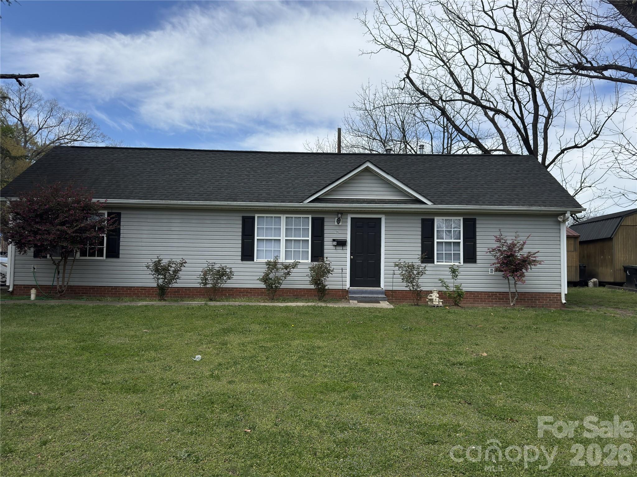 114 South Branch Street Monroe, NC 28112 - Photo 7 of 44 a front view of a house with a garden