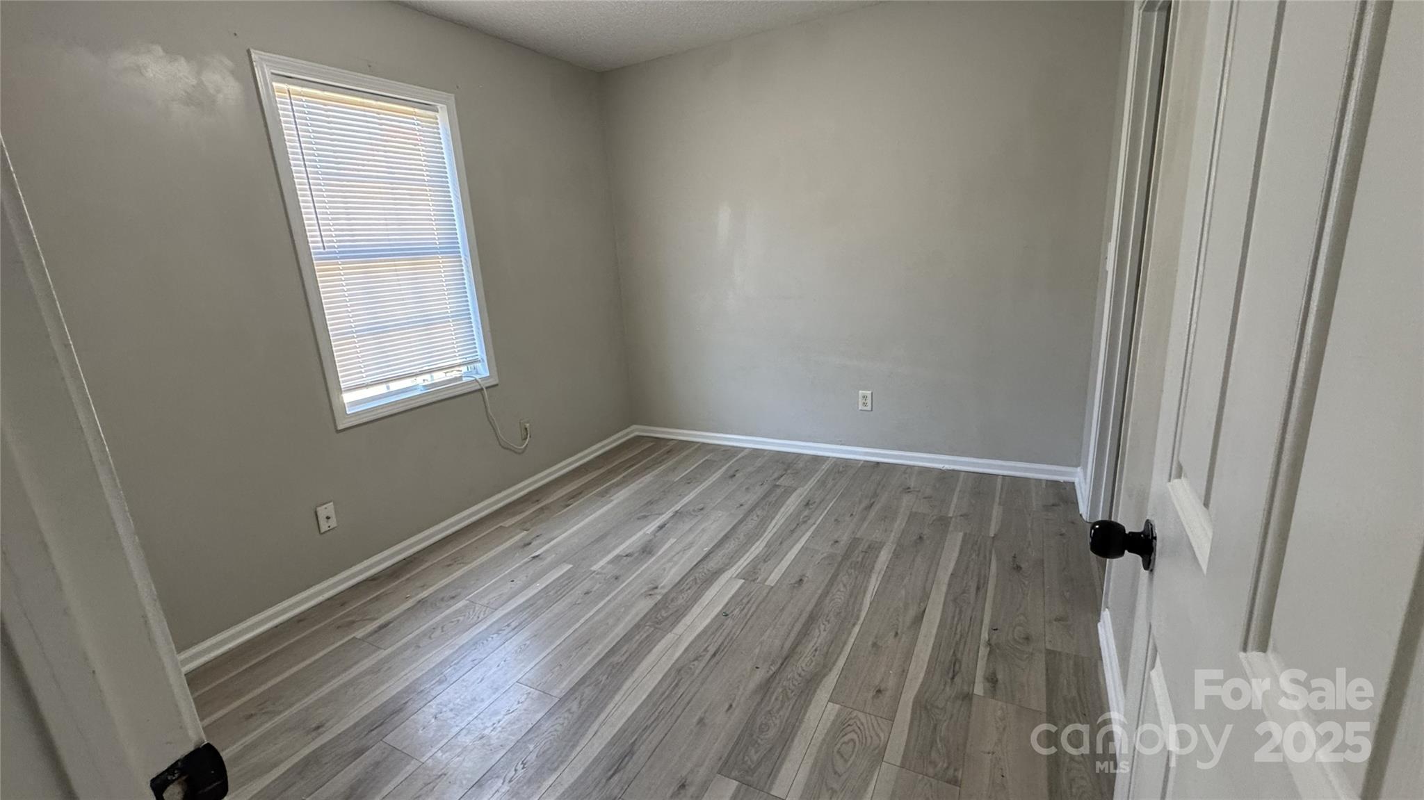 114 South Branch Street Monroe, NC 28112 - Photo 7 of 32 a view of a room with wooden floor and windows