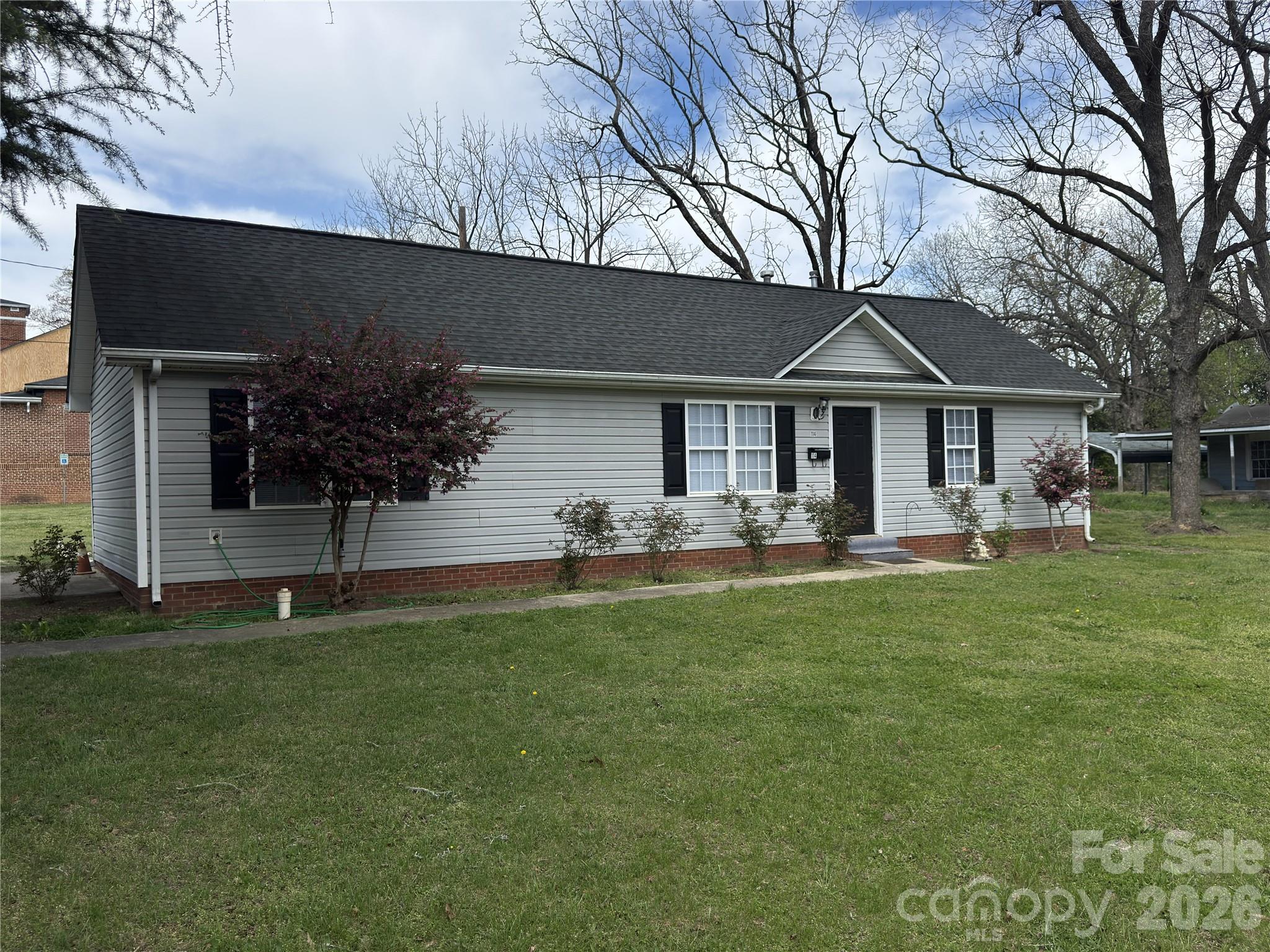 114 South Branch Street Monroe, NC 28112 - Photo 8 of 44 a front view of a house with a garden