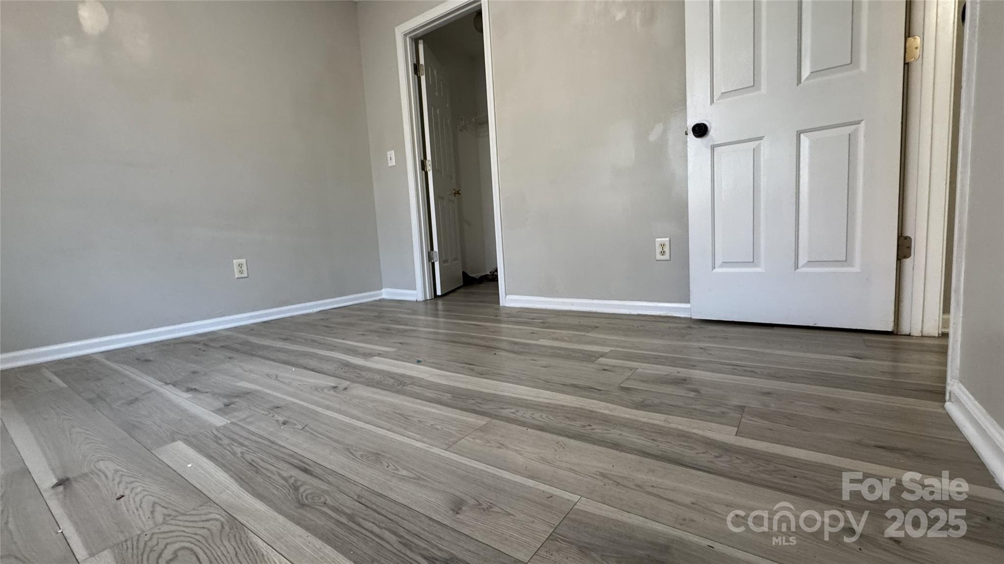 114 South Branch Street Monroe, NC 28112 - Photo 8 of 32 a view of an empty room with wooden floor