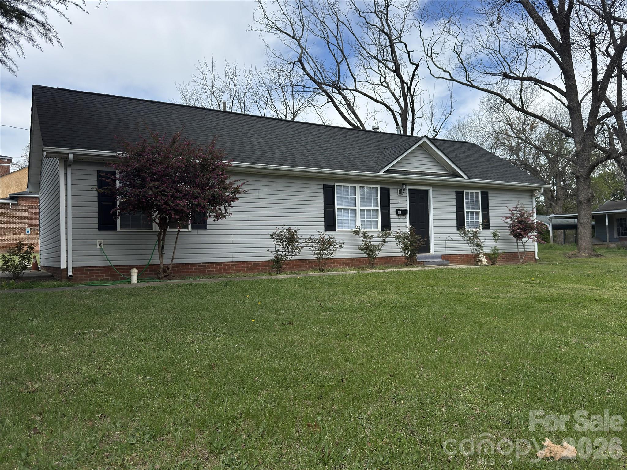 114 South Branch Street Monroe, NC 28112 - Photo 9 of 44 a front view of house with yard and green space