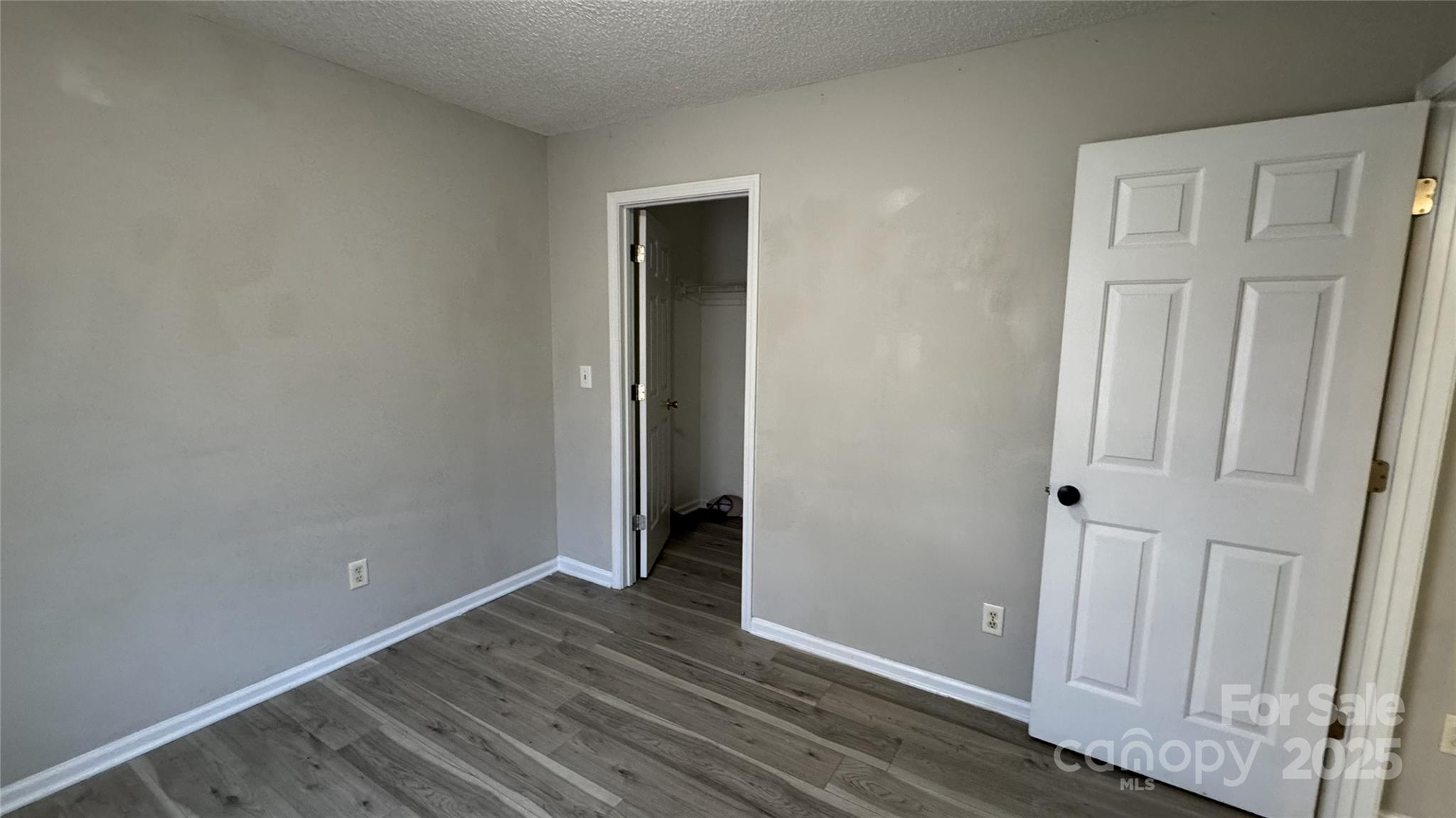 114 South Branch Street Monroe, NC 28112 - Photo 9 of 32 an empty room with wooden floor and closet