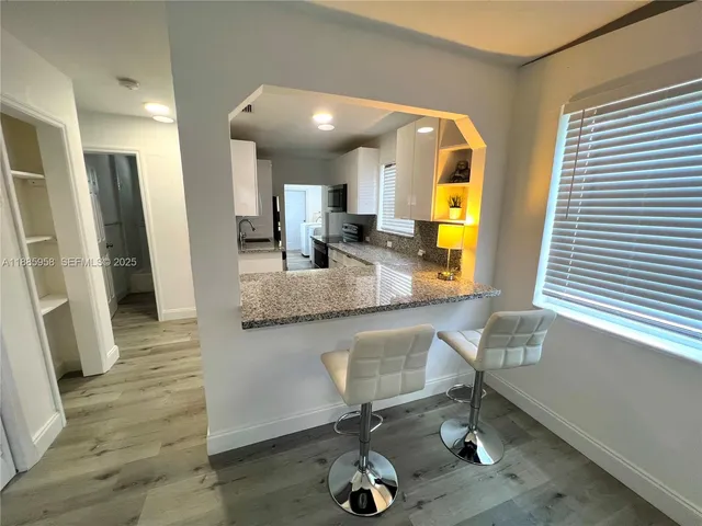 a bathroom with double vanity and a sink