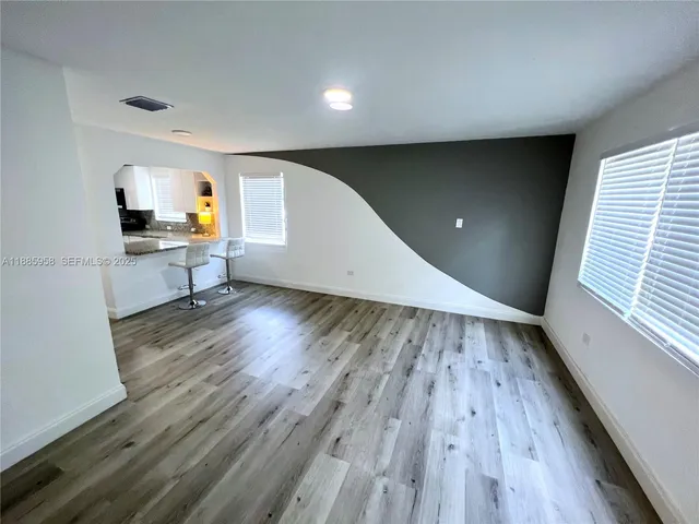 a view of livingroom with furniture and wooden floor