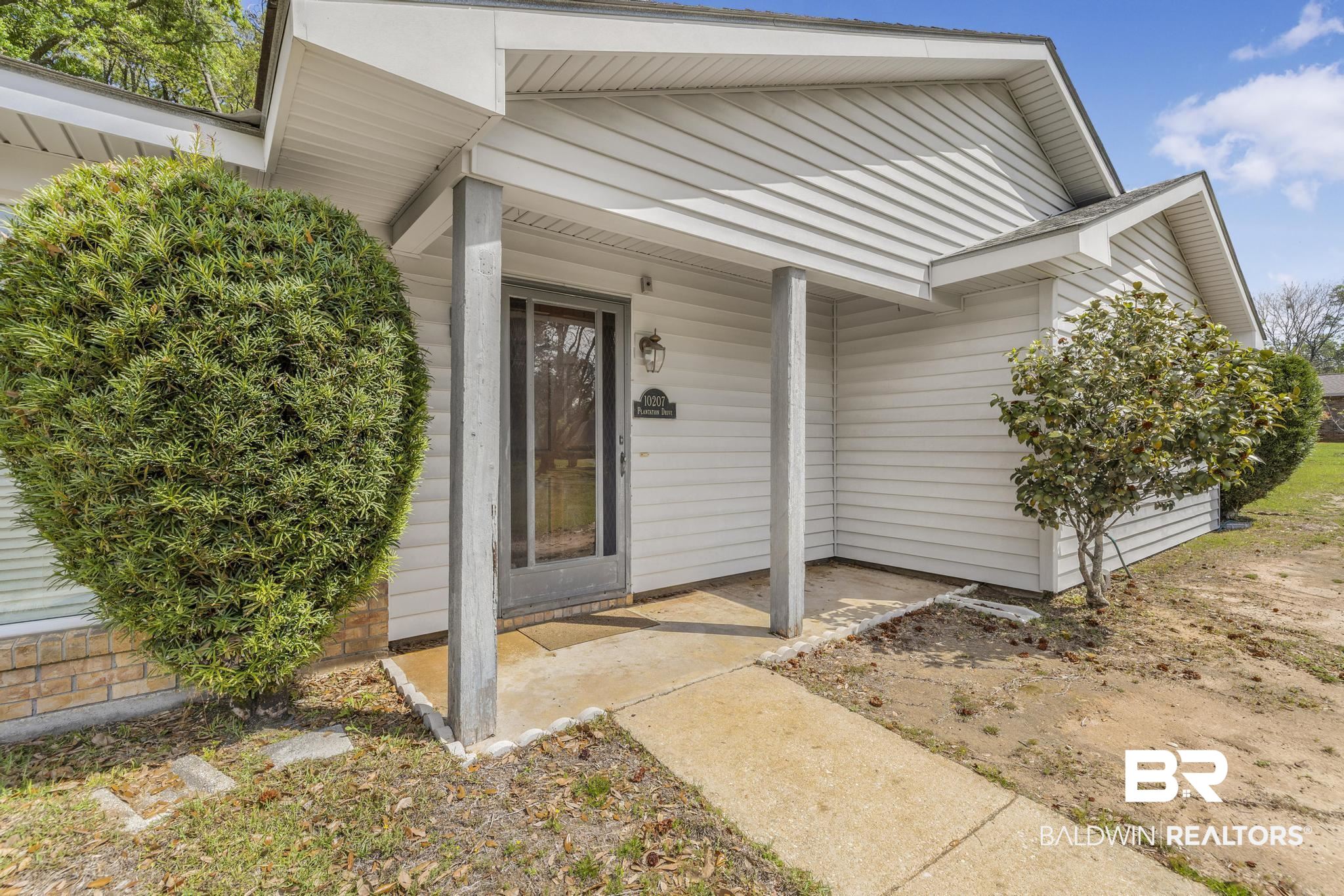 10207 Plantation Drive Daphne, AL 36526 - Photo 3 of 48 Doorway to property featuring a porch