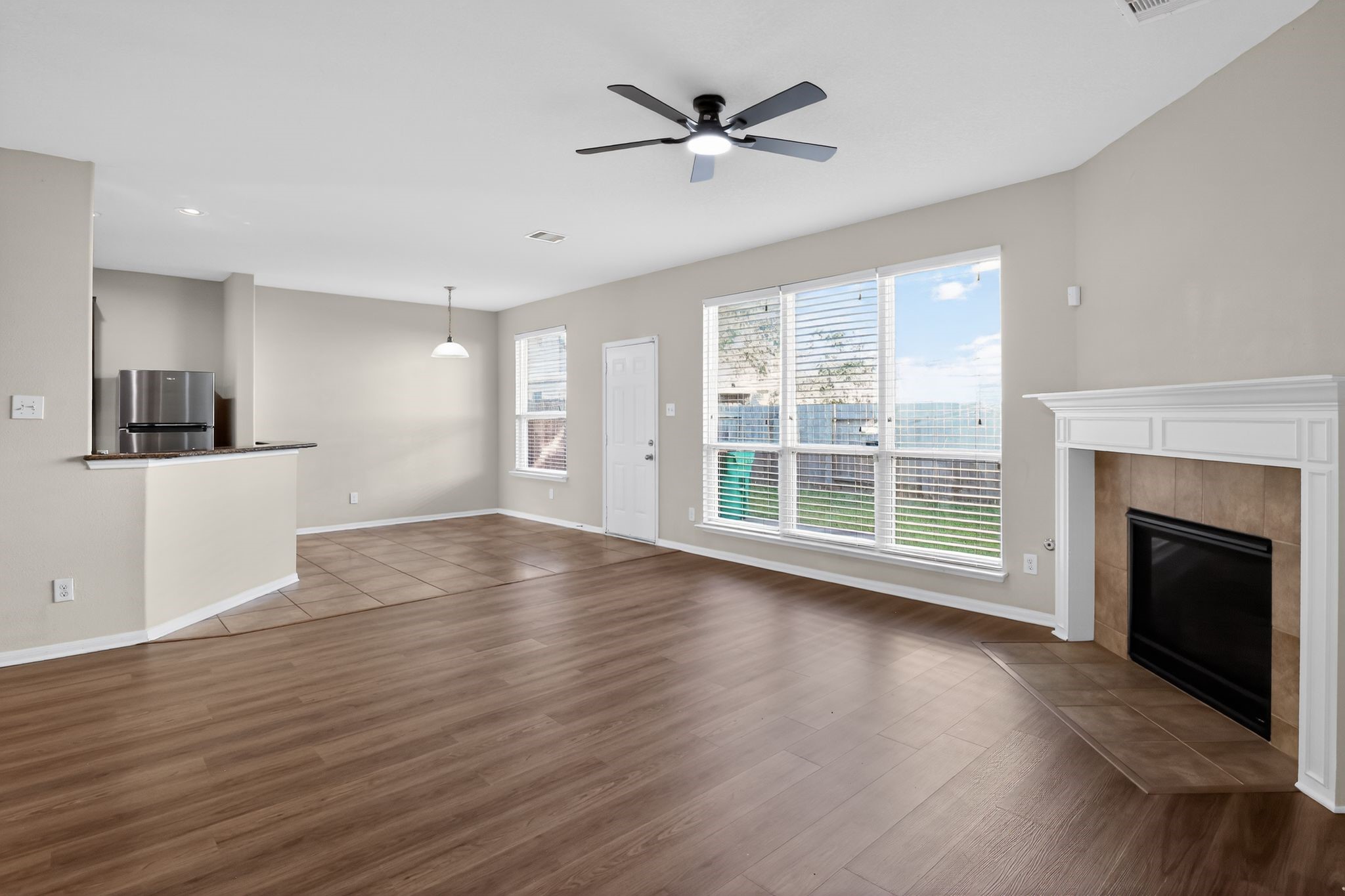 4938 Yearling Ridge Court Katy, TX 77449 - Photo 4 of 29 a view of a livingroom with wooden floor and a fireplace