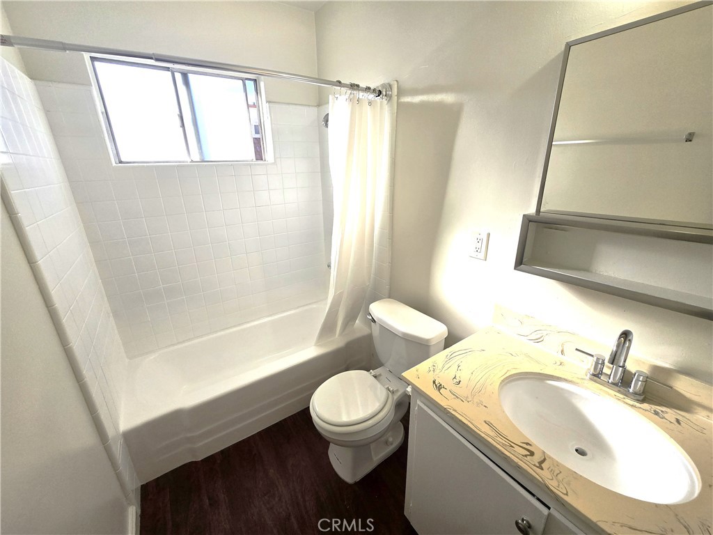 401 West Wilson Avenue, Unit 6 Glendale, CA 91203 - Photo 11 of 12 a bathroom with a sink toilet and shower