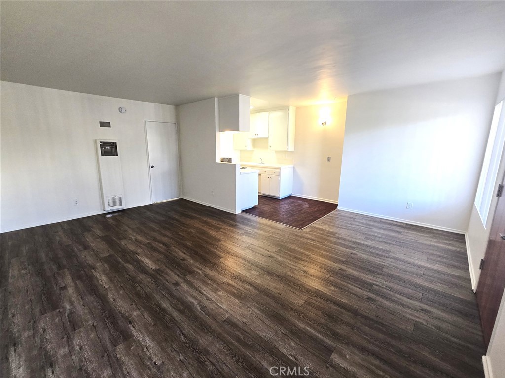 401 West Wilson Avenue, Unit 6 Glendale, CA 91203 - Photo 4 of 12 a view of a room with wooden floor and windows