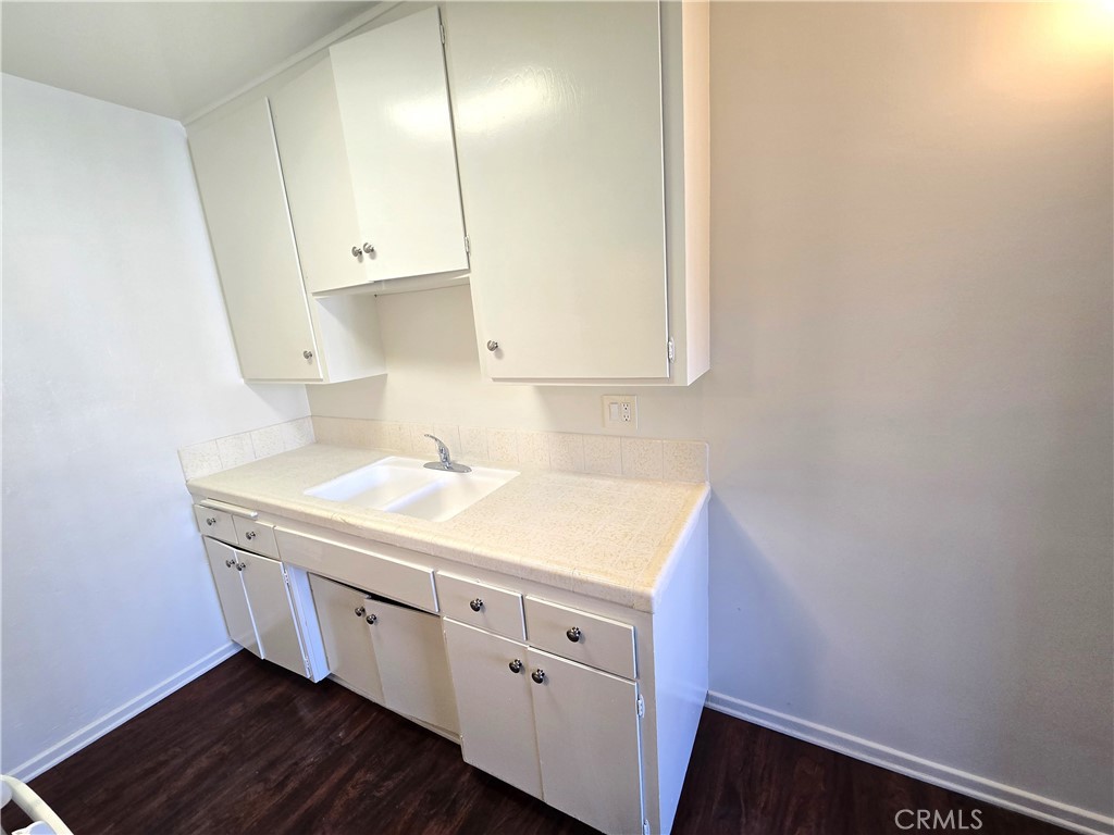 401 West Wilson Avenue, Unit 6 Glendale, CA 91203 - Photo 6 of 12 a utility room with cabinets washer and dryer