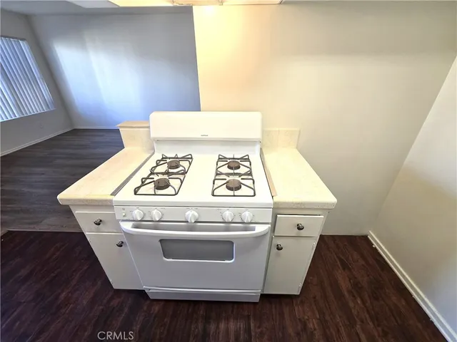 a view of washer and dryer with wooden floor