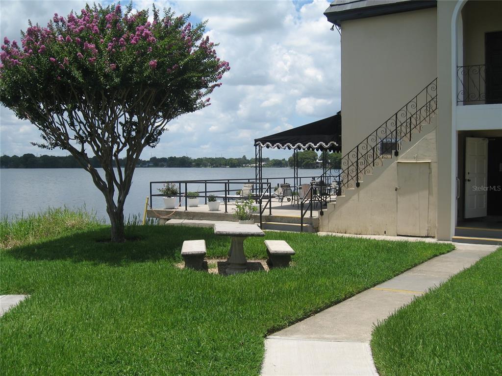 1500 Gay Road, Unit 18A Winter Park, FL 32789 - Photo 20 of 21 a view of a house with backyard sitting area and garden