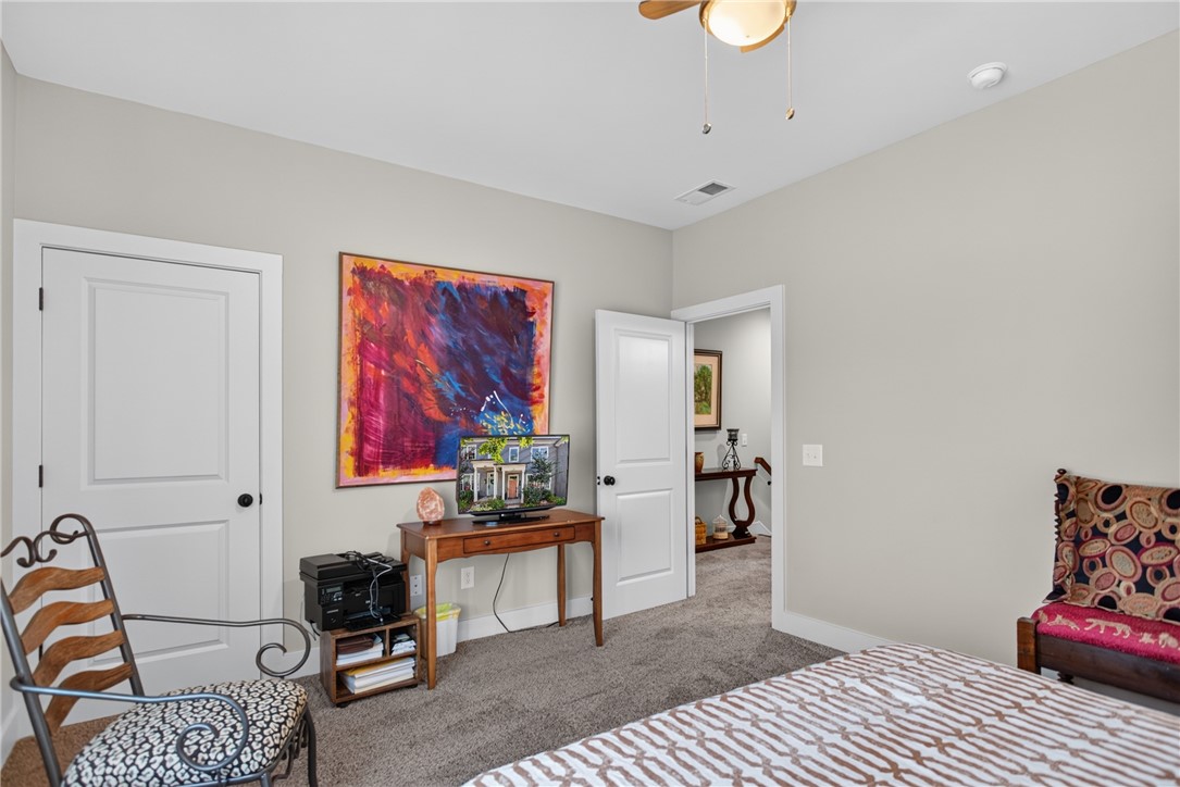 112 Tuttle Street Clemson, SC 29631 - Photo 21 of 46 Plush carpeting underfoot, this well-appointed bedroom provides a tranquil retreat.