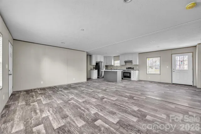 a kitchen with a sink stove and refrigerator
