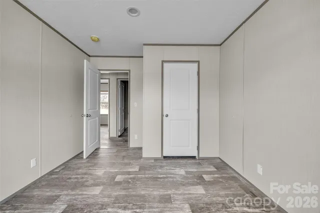 a view of wooden floor with a bench