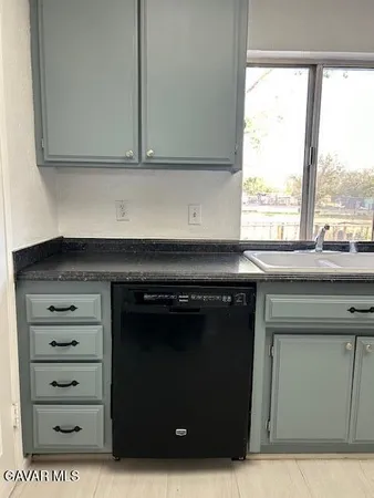 a kitchen with a stove and cabinets
