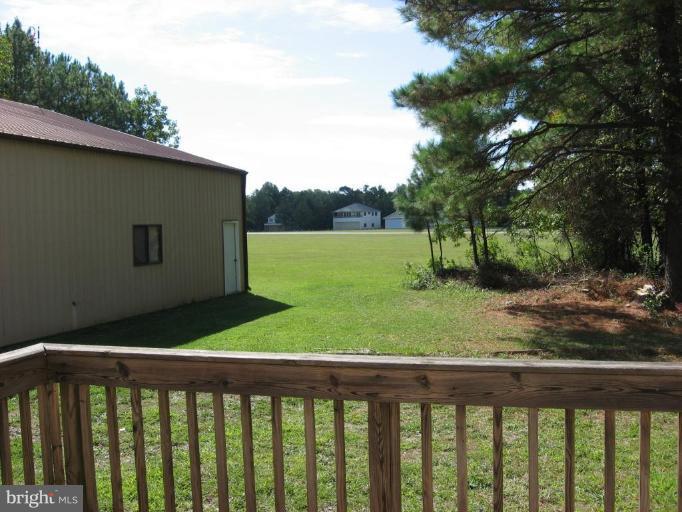 885 Crystal Rock Road Lusby, MD 20657 - Photo 9 of 18 a view of a backyard