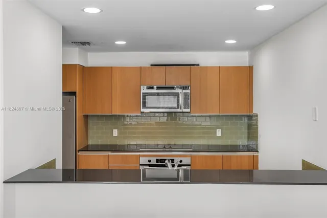 a view of kitchen with wooden floor