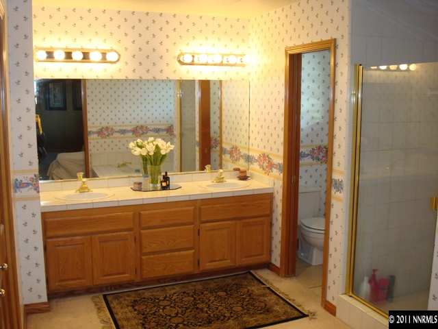 3342 Corey Drive Reno, NV 89509 - Photo 6 of 13 a bathroom with a double vanity sink and a mirror