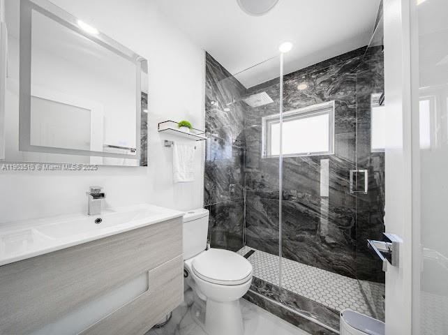 16125 Northwest 28th Place Miami Gardens, FL 33054 - Photo 19 of 25 a bathroom with a sink toilet and shower