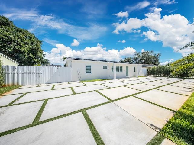 16125 Northwest 28th Place Miami Gardens, FL 33054 - Photo 2 of 25 a house view with a backyard space