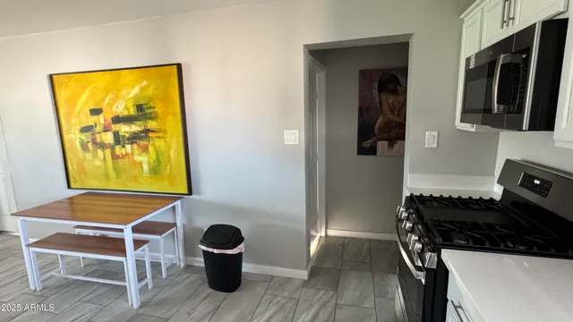 a living room with a table and a window