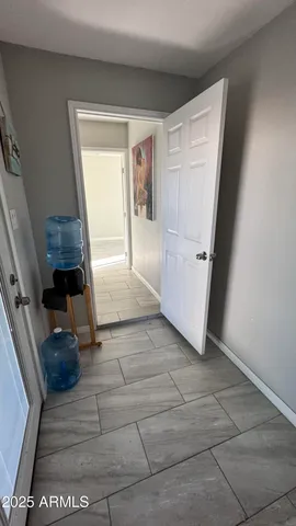a view of a storage & utility room with a window